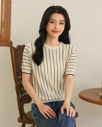 Women's pure cotton loose-fit vertical striped t-shirt featuring a breathable knit fabric and sculpted minimalist crew neck for a flattering elongated silhouette.
