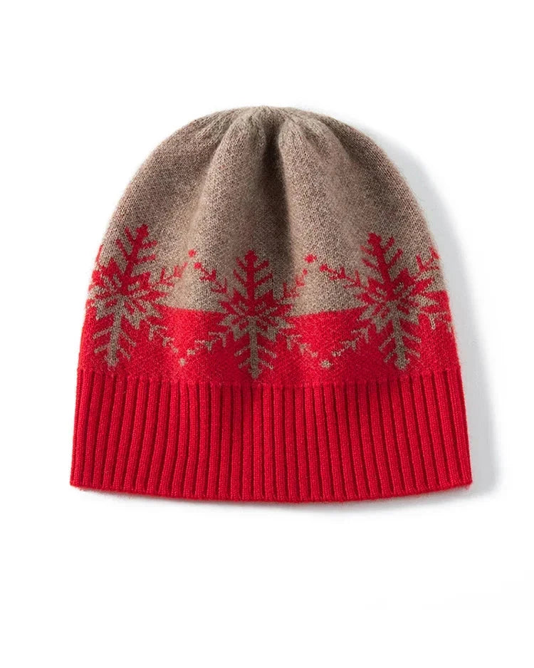 A wool and cashmere beanie with a snowflake jacquard pattern and ribbed brim, designed for a snug unisex fit that packs easily into a coat pocket.