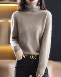 Plush mink cashmere turtleneck sweater for women with tall ribbed collar, fuzzy knit texture, long sleeves and ribbed cuffs, a relaxed fall-winter 100% mink cashmere pullover.