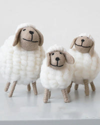 Handcrafted wool felt and wood sheep figurine in three sizes. A charming mini table ornament and party favour for weddings, birthdays, baby showers, and Christmas.