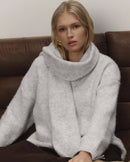 A Loose Soft V-Neck Sweater With A Scarf