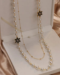 Women’s double-layer long pearl necklace in gold tone, classic pendant chain with lustrous faux pearls, perfect for parties or elegant occasions.