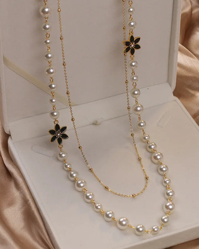 Women’s double-layer long pearl necklace in gold tone, classic pendant chain with lustrous faux pearls, perfect for parties or elegant occasions.