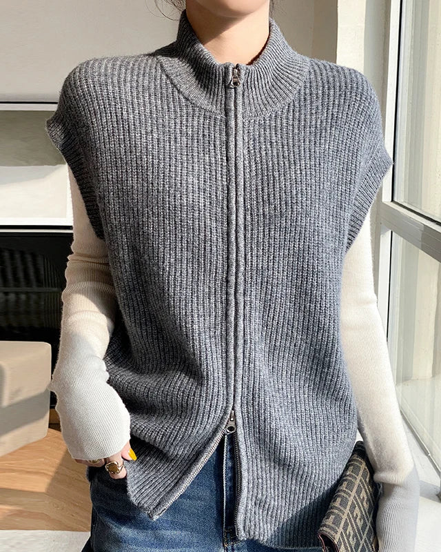Extrafine merino wool zip vest — a sleeveless mock neck knit waistcoat crafted for warmth, softness, and effortless style.