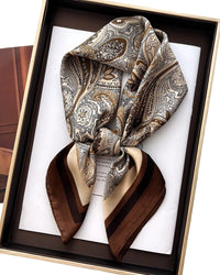 The floral pattern — intricate, layered, and quietly decorative — works equally well tied at the neck, woven through the hair, or knotted at a bag handle.