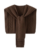The hollow-out twist knit pattern creates a beautiful interplay of light and shadow across the fabric, giving it an artisanal depth that sets it apart from ordinary knitwear.