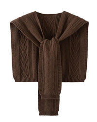 The hollow-out twist knit pattern creates a beautiful interplay of light and shadow across the fabric, giving it an artisanal depth that sets it apart from ordinary knitwear.