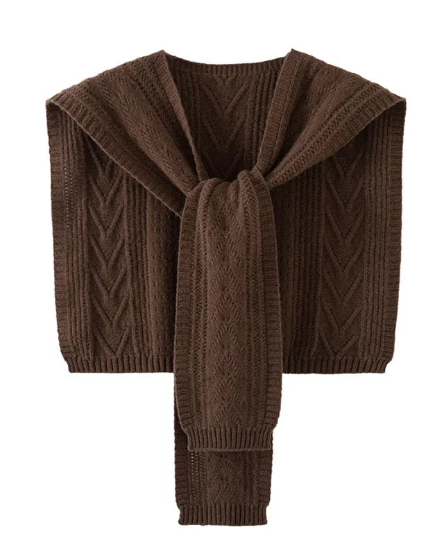 The hollow-out twist knit pattern creates a beautiful interplay of light and shadow across the fabric, giving it an artisanal depth that sets it apart from ordinary knitwear.