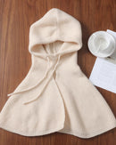 Hooded wool shoulder cape for women with integrated hood, short draped cape shape, knit front ties and ribbed texture, a warm fall-winter 100% wool layer for shoulders.