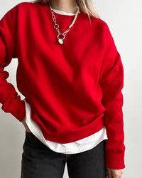 Women's  loose-fit pure cotton pullover sweatshirt featuring breathable fleece fabric, an O-neck collar, and an oversized silhouette for cozy casual and sports wear.