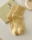 These ankle socks strike the perfect balance between softness and structure. A fine-knit cotton blend hugs the foot without constriction.