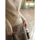 Designers' V-neck Wool Sweater with Asymmetrical Buttons