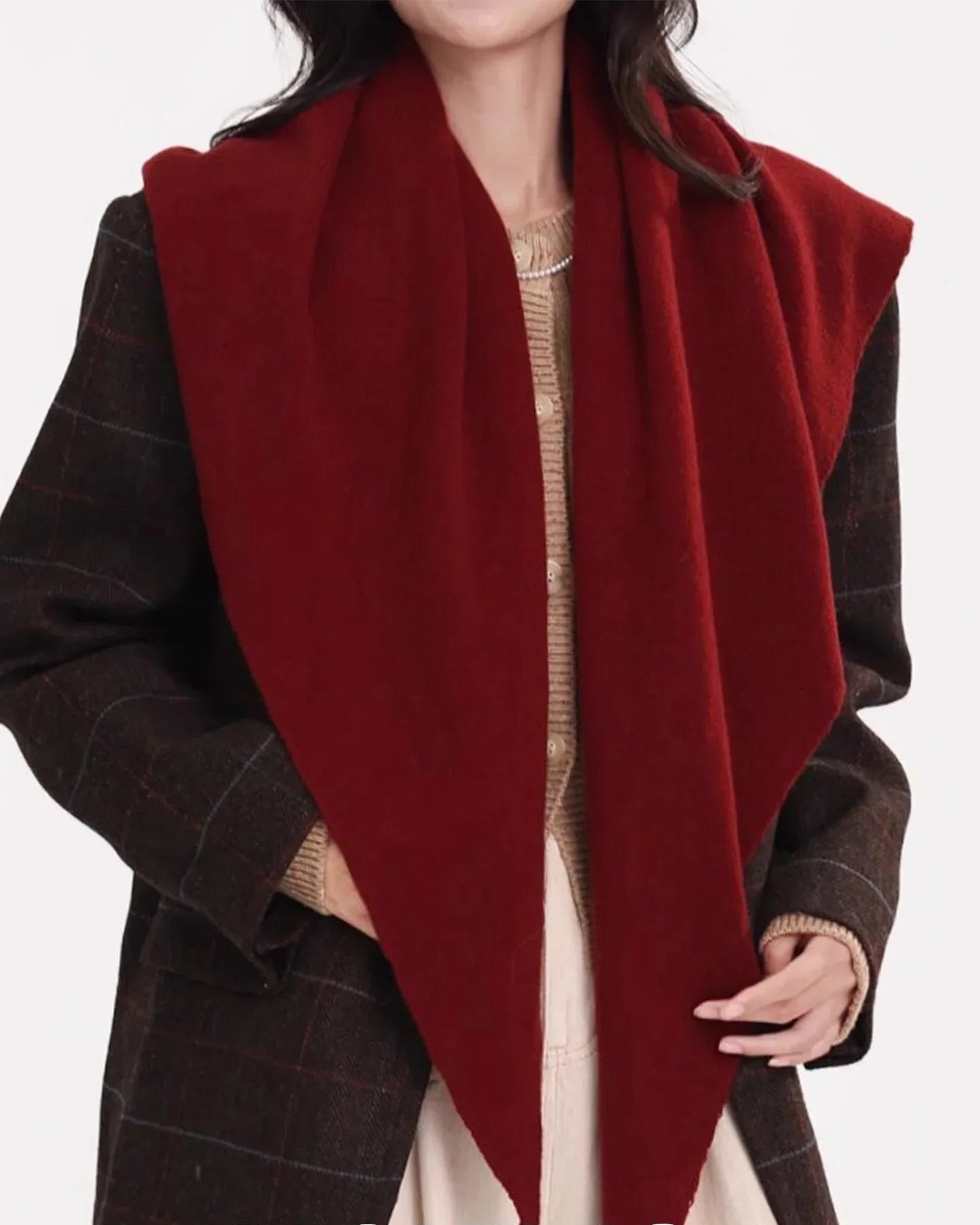 A pure wool triangle scarf is one of the most versatile cold-weather accessories a woman can own.