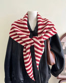 Wool blend striped knit triangle scarf in cream with multicolor stripes, cozy textured shawl with multifunctional styling, perfect for fall and winter warmth.