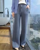 Mink cashmere knit wide leg pants with a high drawstring waist and deep pockets, designed for soft office-ready warmth from desk to dinner.