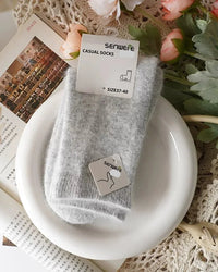 Women's Wool and rabbit hair mid-tube socks featuring a sculpted mid-tube cuff, plush blend fabric, and relaxed stretch knit, perfect for delivering poised warmth in cold office environments.