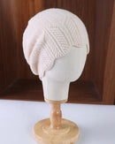 Scalloped pointelle wool beanie with leaf-pattern openwork, softly shaped scalloped edge and textured knit crown, a delicate solid fall-winter wool hat for commuting or walks.