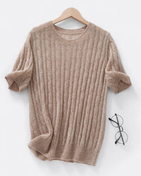 A cable-knit short-sleeve top with crewneck, cable knit, ribbed edges, regular fit, short sleeves and stretch, designed for a cozy winter layering look that pairs from sneakers to boots.