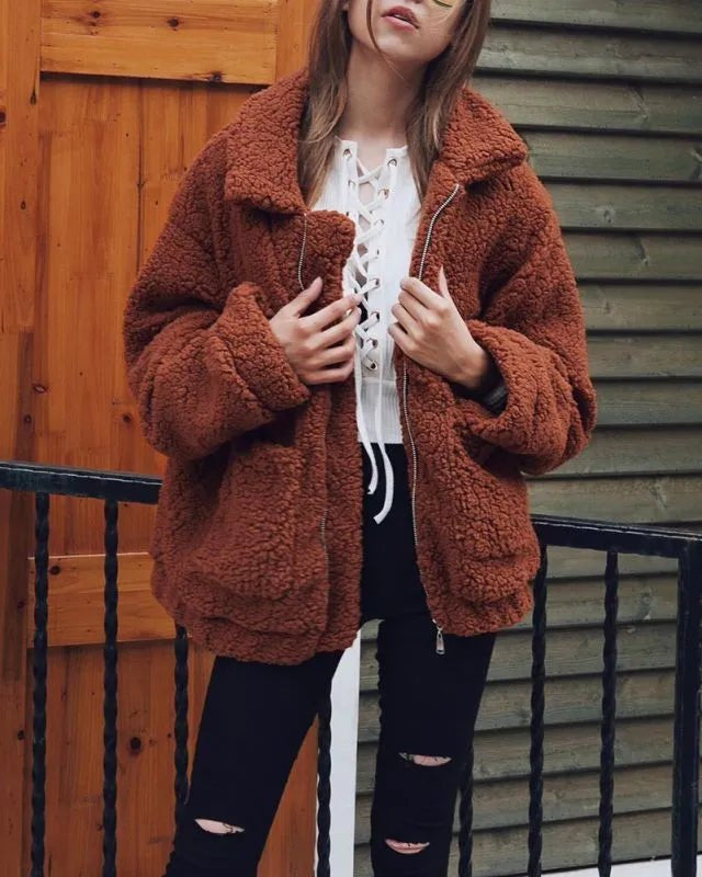 Teddy Fleece faux fur jacket for women with a casual winter style, thick and warm coat features a classic turn-down collar, a full-zip front closure, and regular-length sleeves, offering a cozy and chic look for the colder months.