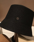 Solid-colour polyester bucket hat with a clean minimal silhouette, adjustable fit (56–58 cm). Lightweight and versatile — casual outdoor wear for all seasons.