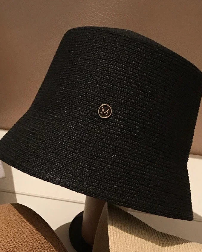 Solid-colour polyester bucket hat with a clean minimal silhouette, adjustable fit (56–58 cm). Lightweight and versatile — casual outdoor wear for all seasons.