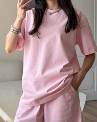 Women's loose cotton knit O-neck tee featuring breathable fabric, a half sleeve, and a relaxed fit for effortless summer casual and sports wear.