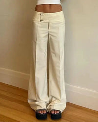 A low-rise straight-leg trouser with a button fly and relaxed fit, designed for a clean Y2K-inspired look that pairs from sneakers to boots.