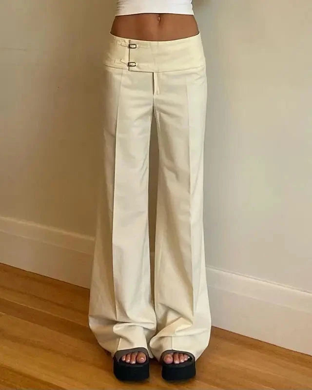 A low-rise straight-leg trouser with a button fly and relaxed fit, designed for a clean Y2K-inspired look that pairs from sneakers to boots.