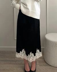 Women's satin A-line midi skirt featuring breathable polyester fabric, intricate lace patchwork panels, and a side zipper for a refined fit in summer office wear.