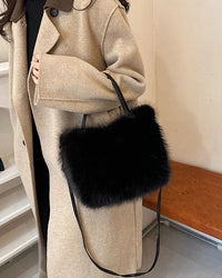 A soft faux fur bucket tote with a casual shape, polyester lining and shoulder or crossbody carry, designed for a roomy everyday look that moves from day to evening.
