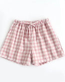 Women's Cotton plaid sleep shorts featuring an elastic drawstring waist and relaxed straight leg, crafted for breathable comfort with a classic plaid pattern that moves seamlessly from lazy mornings to breezy evenings.