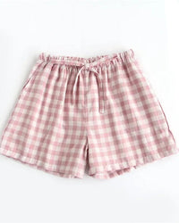 Women's Cotton plaid sleep shorts featuring an elastic drawstring waist and relaxed straight leg, crafted for breathable comfort with a classic plaid pattern that moves seamlessly from lazy mornings to breezy evenings.