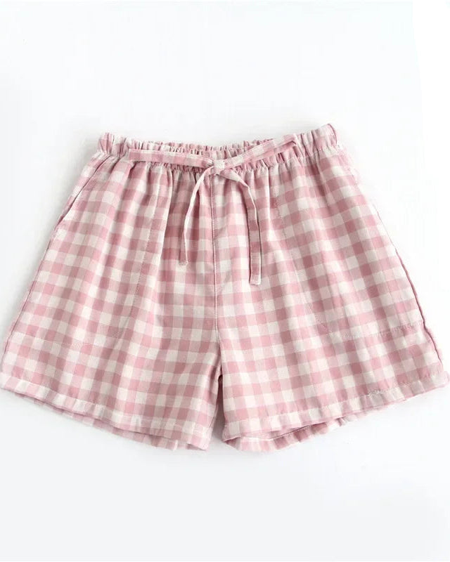 Women's Cotton plaid sleep shorts featuring an elastic drawstring waist and relaxed straight leg, crafted for breathable comfort with a classic plaid pattern that moves seamlessly from lazy mornings to breezy evenings.