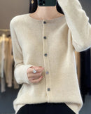 A pure wool O-neck cardigan with a button-front closure and ribbed trim, designed for a soft, classic look suitable for layering.