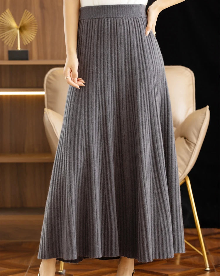 100% merino wool solid pleated ankle-length knit skirt. Warm, soft, and medium stretch — elegant Korean office casual autumn winter knitwear for women.