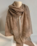 Classic cashmere shawl in cream with geometric print, soft knitted wrap with multifunctional styling, perfect for fall and winter warmth and elegance.