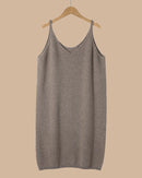 Longline merino wool cami for women with slim shoulder straps, sleeveless loose knit silhouette and extra length, a warm fall-winter layering top for everyday outfits.