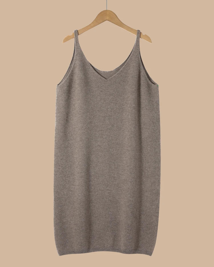 Longline merino wool cami for women with slim shoulder straps, sleeveless loose knit silhouette and extra length, a warm fall-winter layering top for everyday outfits.