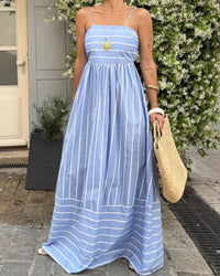 Women's Striped Spaghetti-strap backless maxi dress crafted from lightweight polyester, featuring a square neckline and A-line silhouette for elegant holiday parties and breezy seaside evenings.