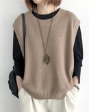 Oversized cotton knit sleeveless vest. Loose fit, breathable pure cotton, round neckline.
