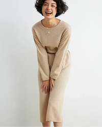 This cashmere midi dress is a study in considered simplicity. The loose, unstructured fit moves naturally with the body, offering warmth without weight.