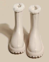 The plush interior cradles the foot in softness, while the round toe and low square heel offer all-day comfort.