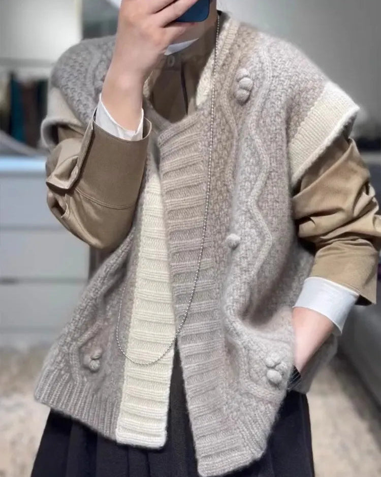 The relaxed, generous fit drapes effortlessly over the body, while the round neck keeps the silhouette clean and versatile.