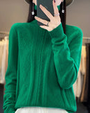 A merino wool turtleneck sweater featuring a geometric jacquard pattern, a seamless knit, and a relaxed fit for a cozy, sophisticated look.
