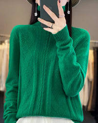 A merino wool turtleneck sweater featuring a geometric jacquard pattern, a seamless knit, and a relaxed fit for a cozy, sophisticated look.