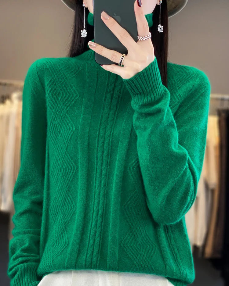 A merino wool turtleneck sweater featuring a geometric jacquard pattern, a seamless knit, and a relaxed fit for a cozy, sophisticated look.