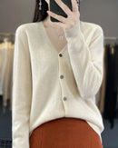 A 100% Australian extrafine merino wool V-neck cardigan with a button front and relaxed fit, designed for soft anti-pilling warmth that layers easily over tees.