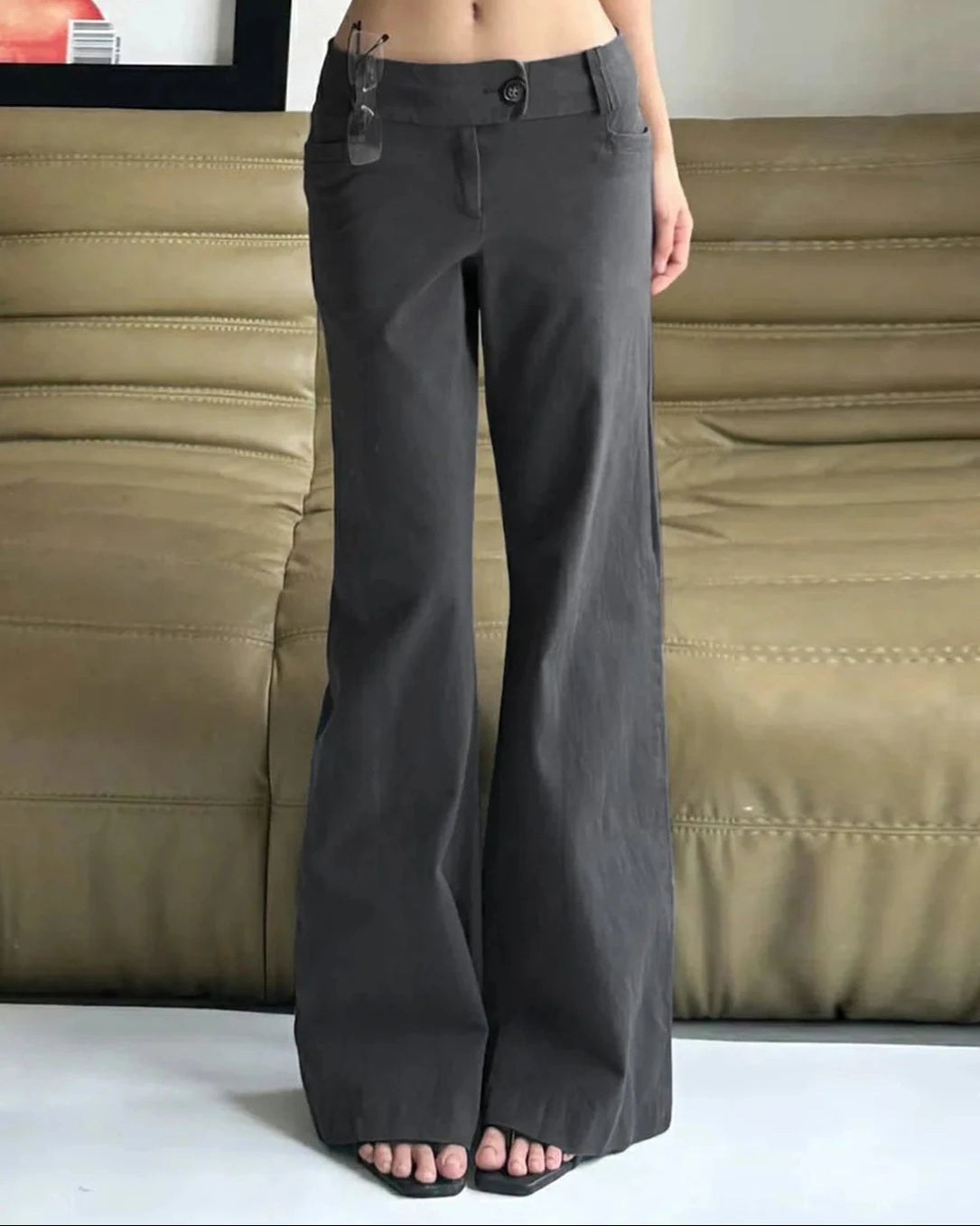 A low-rise wide-leg pant in a soft cotton blend with a relaxed drape, designed for a fluid Y2K-inspired look that pairs from sneakers to heels.