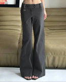 A low-rise wide-leg pant in a soft cotton blend with a relaxed drape, designed for a fluid Y2K-inspired look that pairs from sneakers to heels.