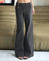 A low-rise wide-leg pant in a soft cotton blend with a relaxed drape, designed for a fluid Y2K-inspired look that pairs from sneakers to heels.
